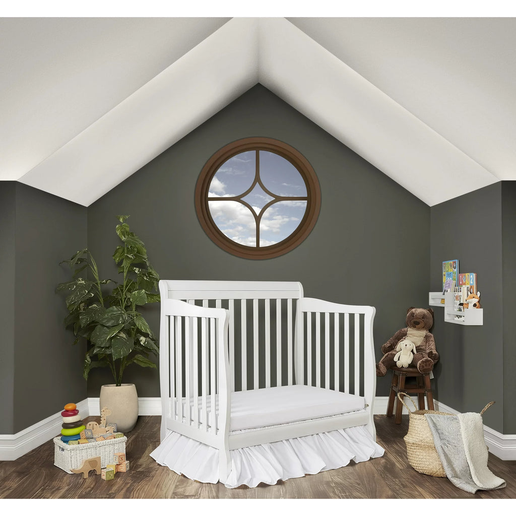 Mini crib top toddler rail